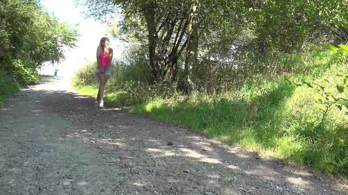 15P Blonde girl Delphine squats for a piss on a gravel path in the country