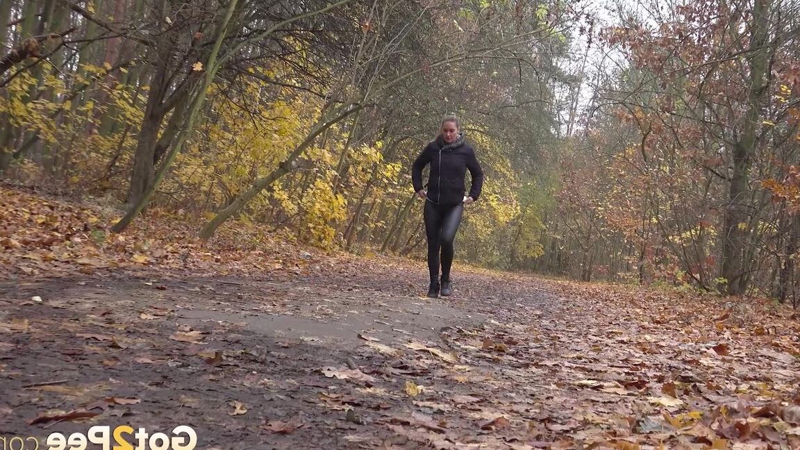 15P White girl Naomi Bennet takes a pee on a path while walking through a forest