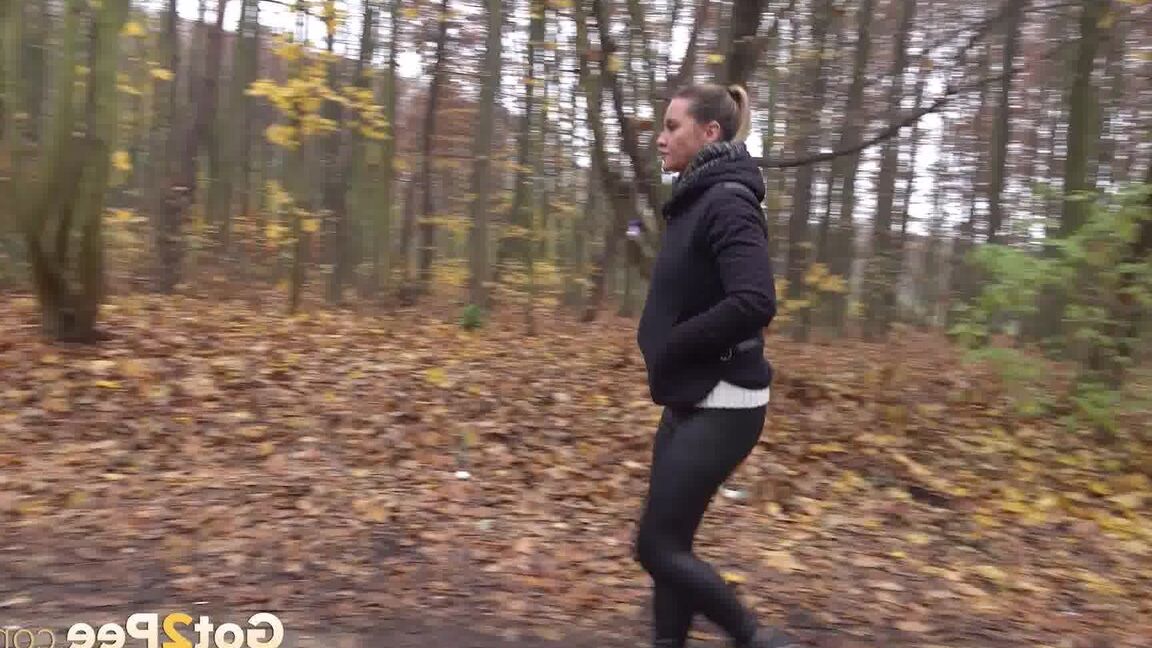 15P White girl Naomi Bennet takes a pee on a path while walking through a forest