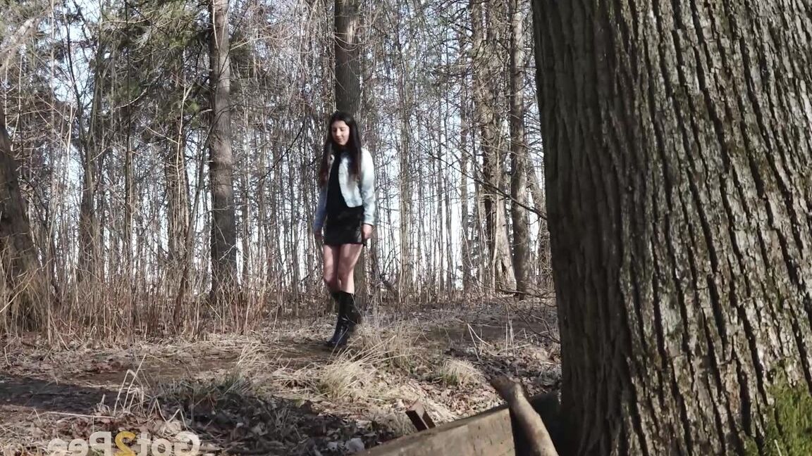 15P Short taken girl Katya holds her ass while taking a piss in the woods