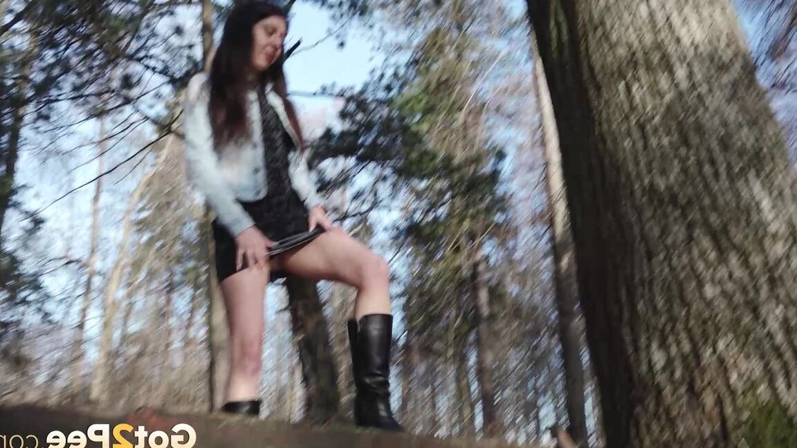 15P Short taken girl Katya holds her ass while taking a piss in the woods