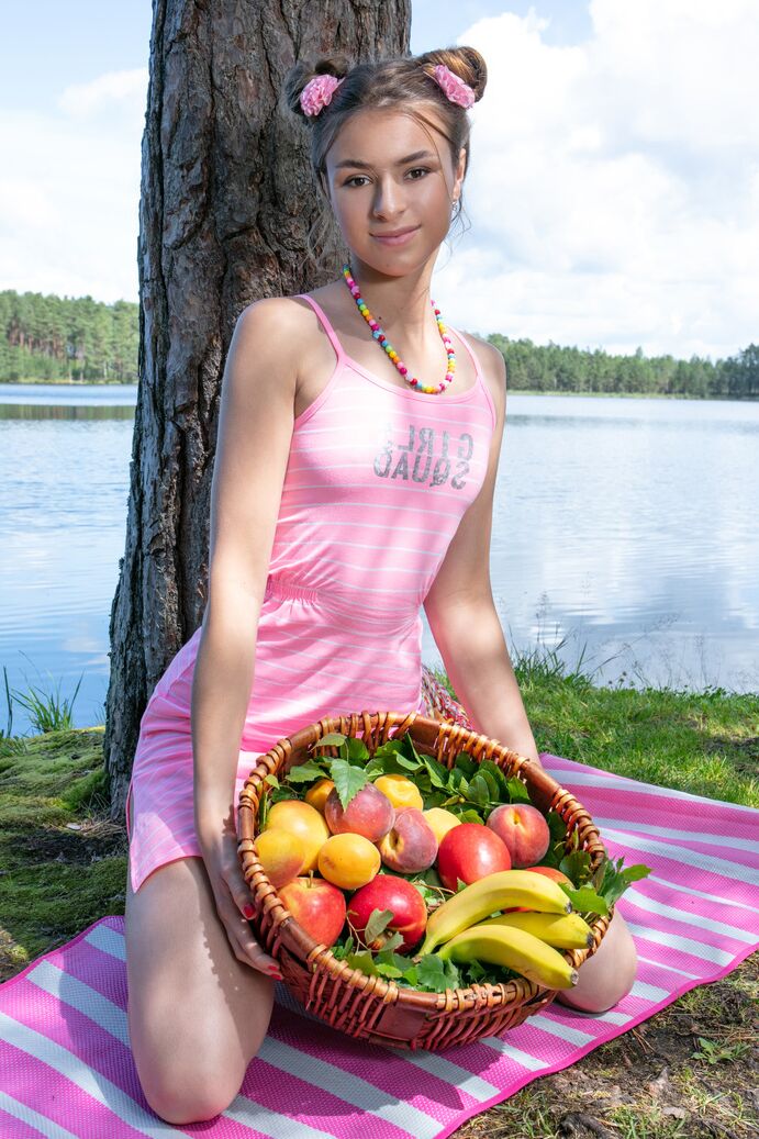 20P Charming teen Lisa gets naked in puffballs under a tree by the water
