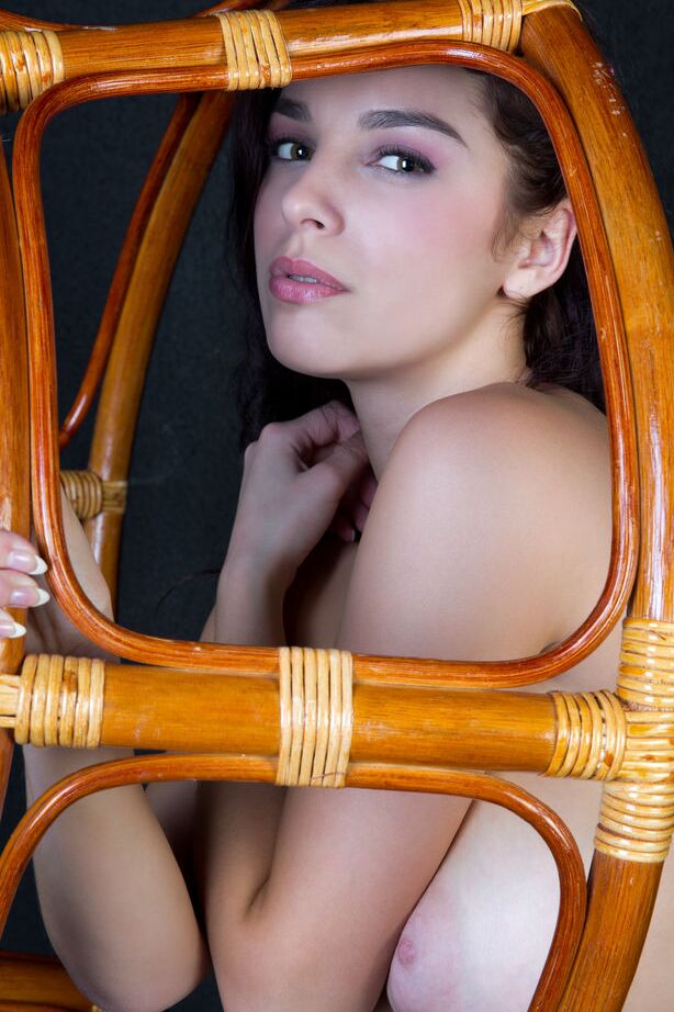 16P Horny young Evita Lima spreading wide open on a chair to show closeup pink
