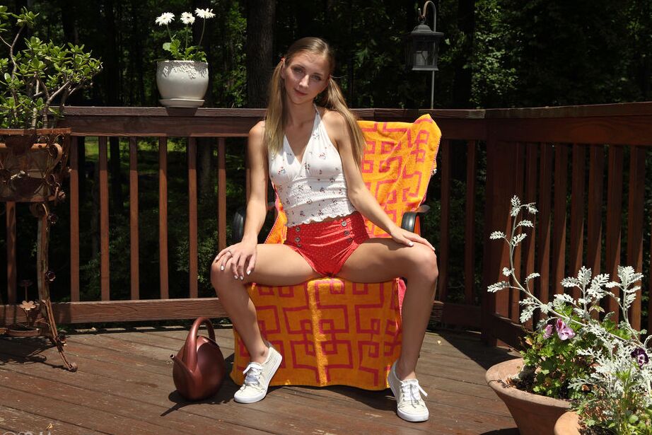 16P Blonde teen Macy Meadows waters her twat after clamping it wide open on a deck