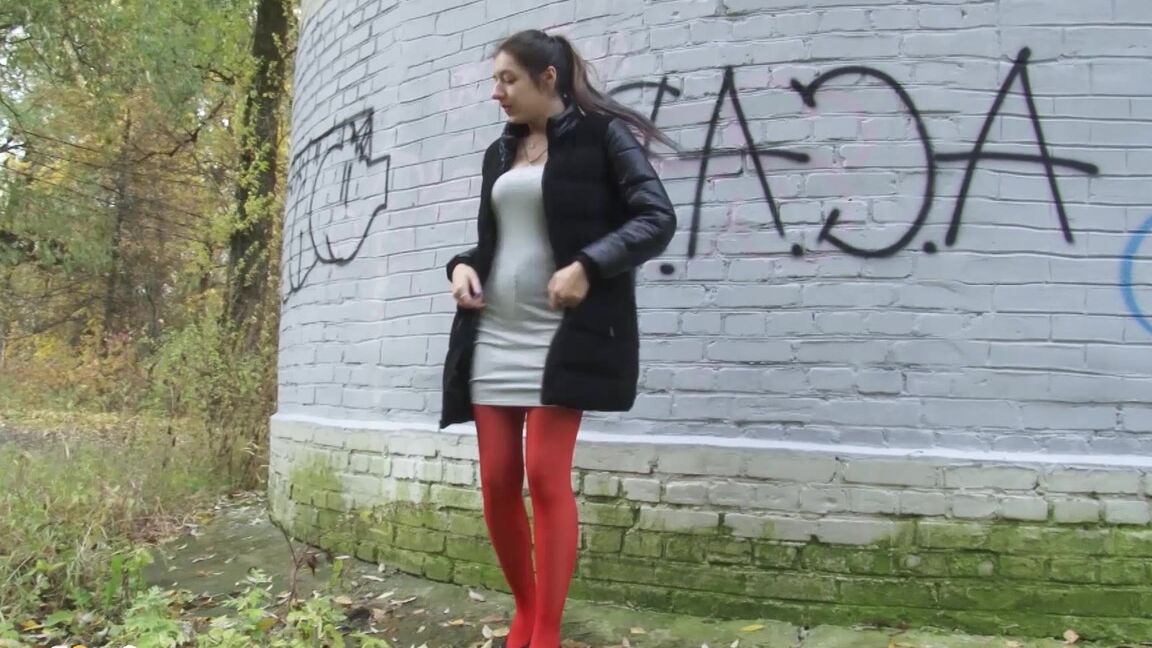 15P Pretty brunette pulls down pantyhose to pee