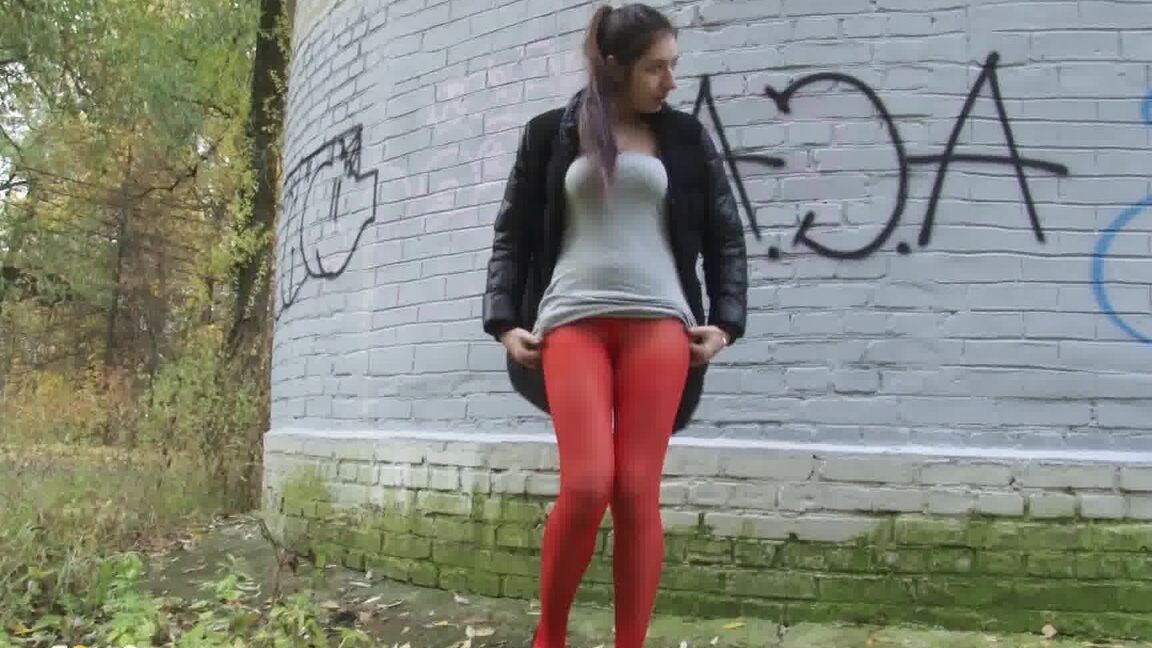 15P Pretty brunette pulls down pantyhose to pee