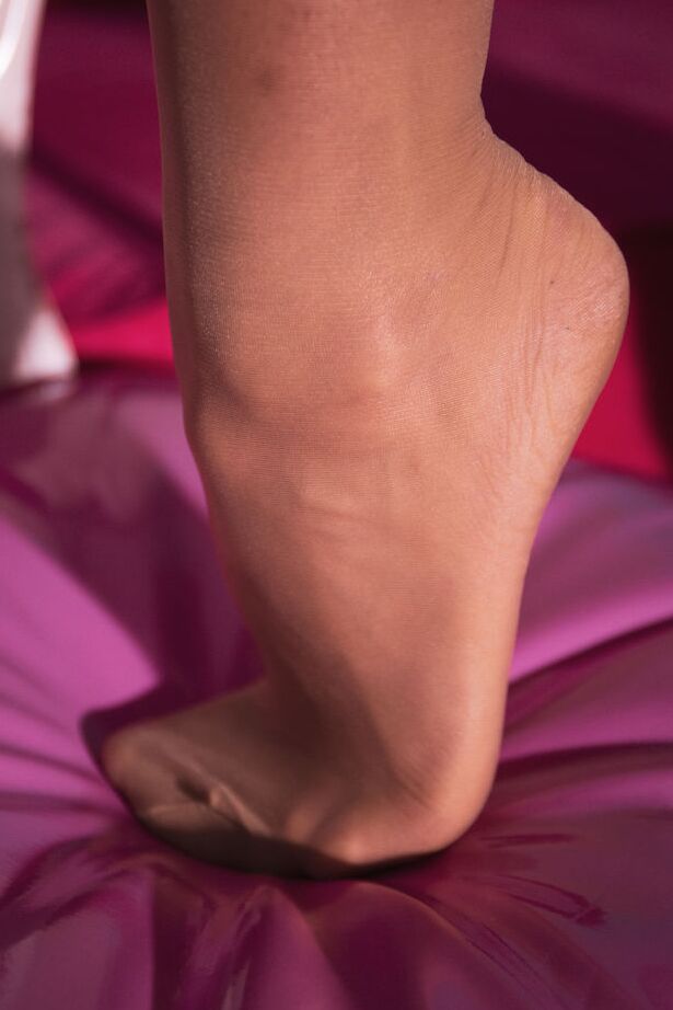 16P Kerry Bradshow moans softly as she masturbates her shaved pussy, as she bends