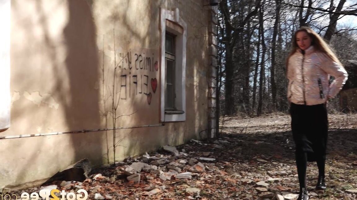 15P Short taken girl Vika squats for a piss behind a graffitied building