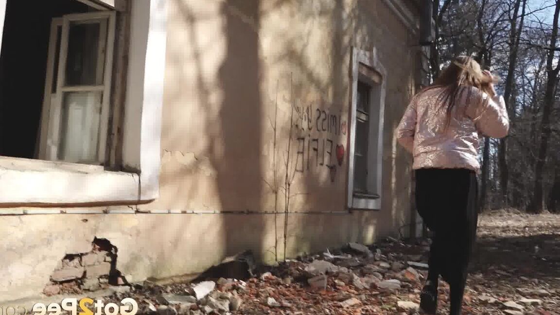 15P Short taken girl Vika squats for a piss behind a graffitied building