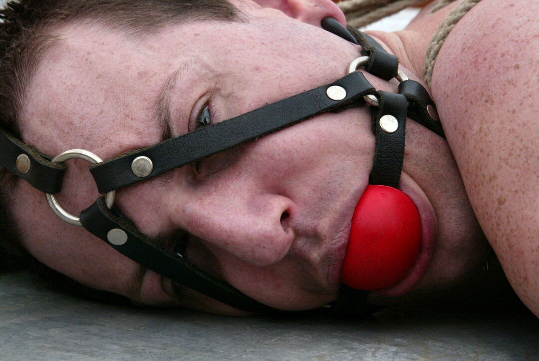 20P Sexy dominatrix Isis Love fucks her bound ball gagged slave with a strapon