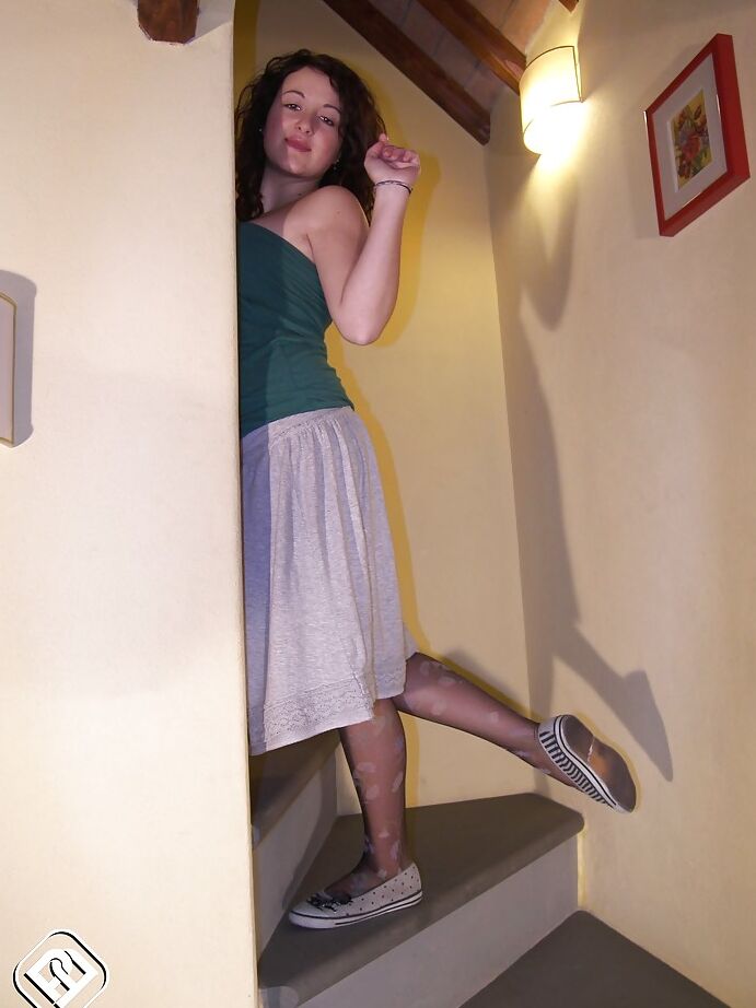 16P Ylenia is just sitting there on the stairs and showing her sexy legs