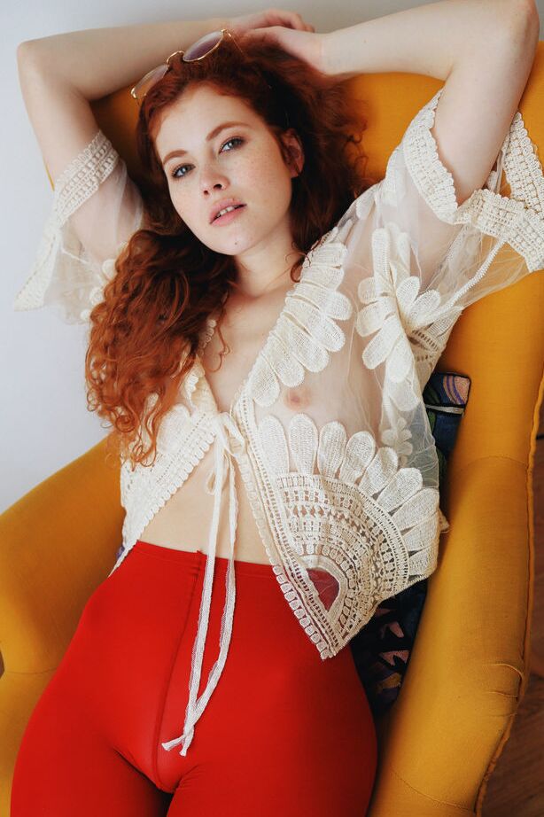 18P Pale redhead Adel C removes red leotards before showcasing her bald pussy