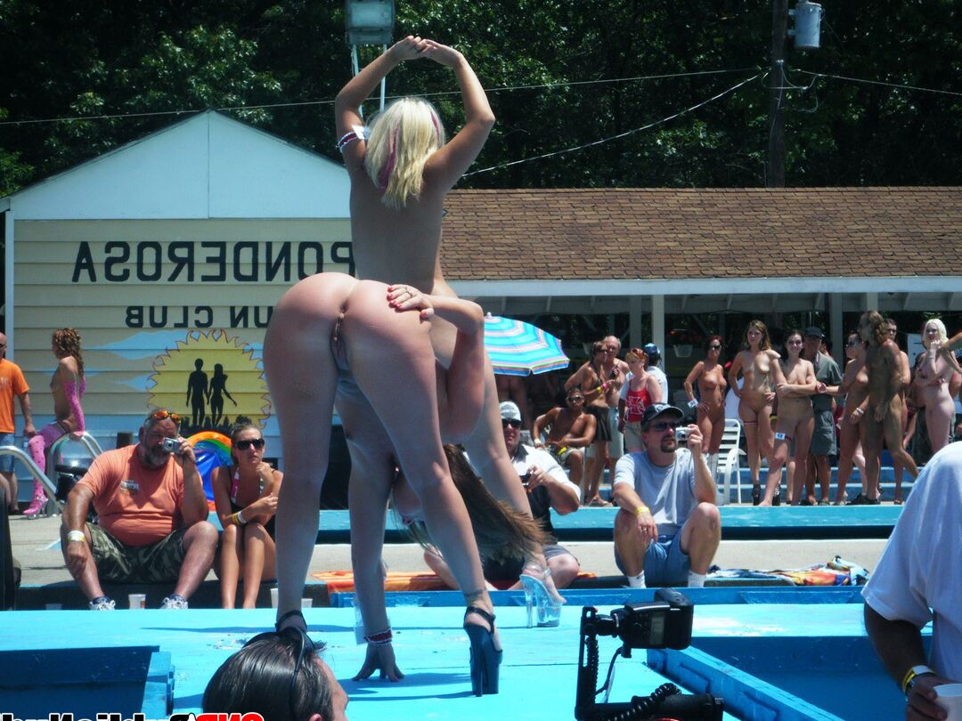 12P Multiple naked strippers on stage at an ourdoor public nudity party