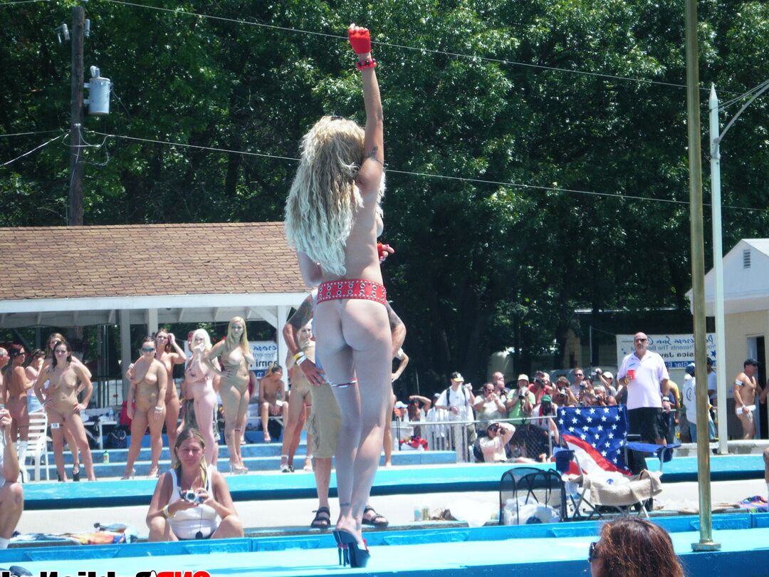 12P Multiple naked strippers on stage at an ourdoor public nudity party