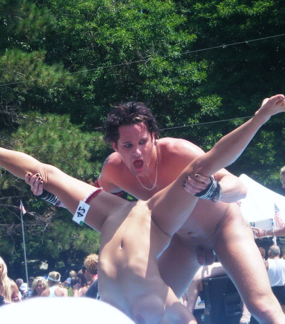 12P Multiple naked strippers on stage at an ourdoor public nudity party