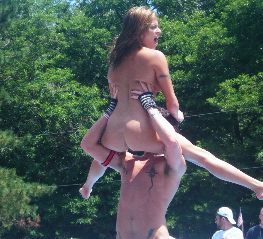 12P Multiple naked strippers on stage at an ourdoor public nudity party