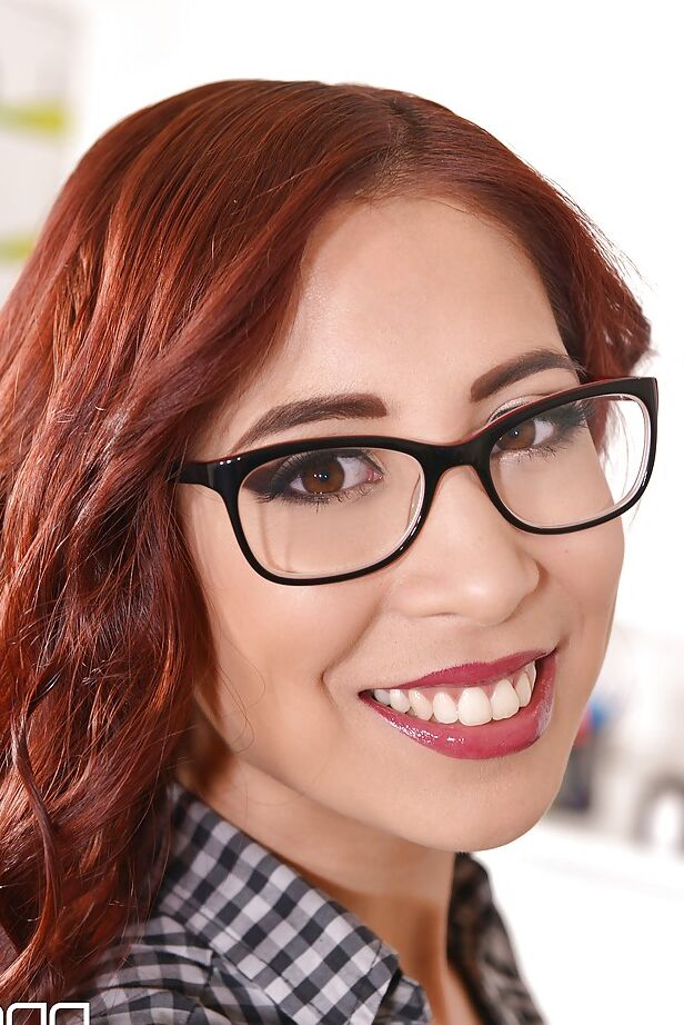 16P Redhead office worker Paula Shy finger fucking on desk wearing glasses
