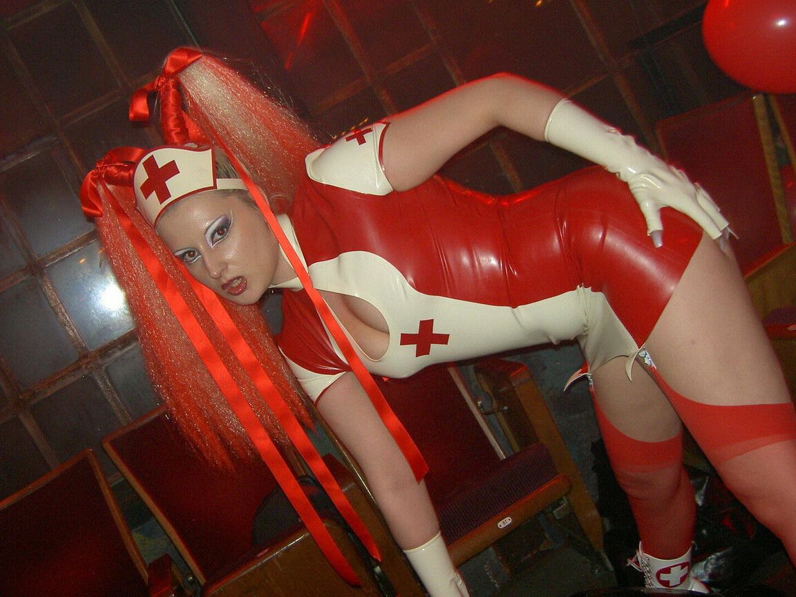 16P Latex attired chicks Darkwing Zero and Joanne Lafontaine play lezdom games