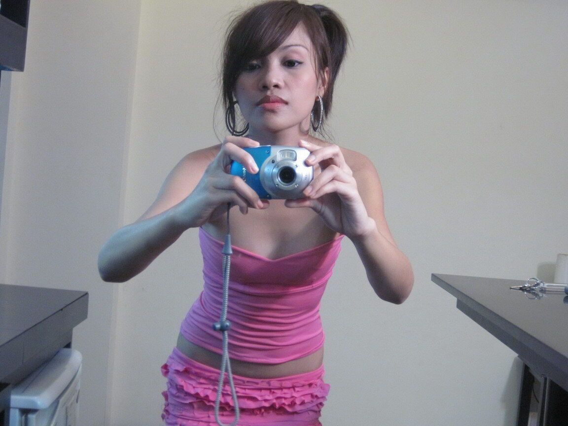 12P Cute teen Asian takes self shots in a mirror while getting naked
