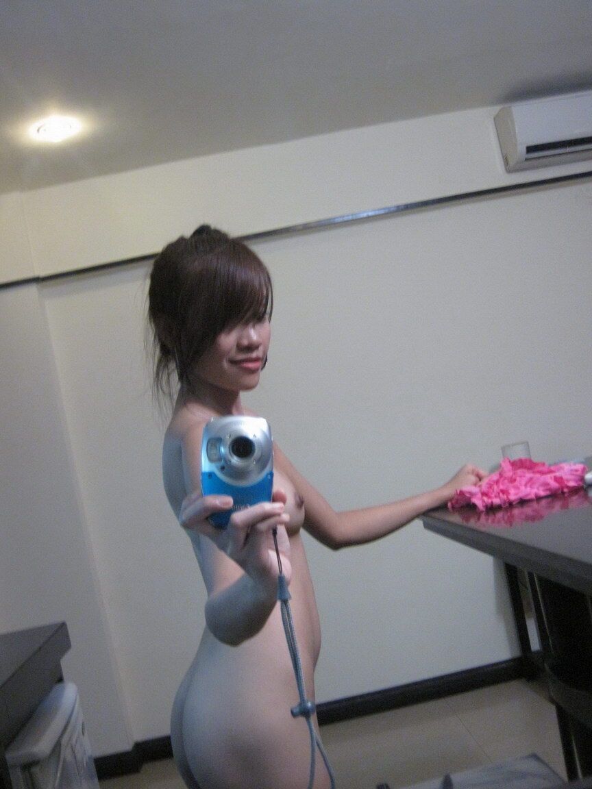 12P Cute teen Asian takes self shots in a mirror while getting naked