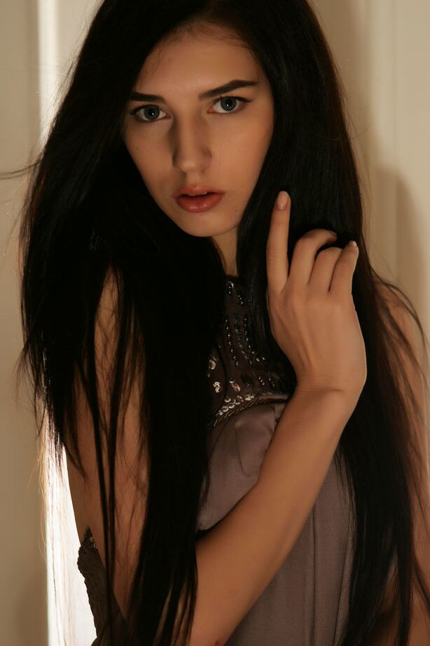 18P Fully clothed brunette Alice E strips mini dress to display pierced tits