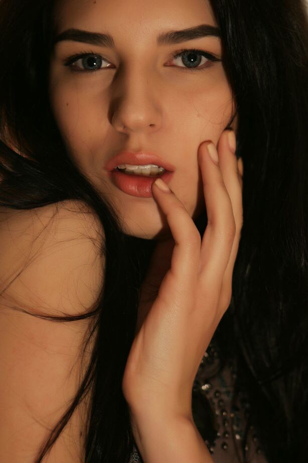 18P Fully clothed brunette Alice E strips mini dress to display pierced tits