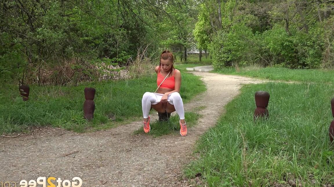 15P Redhead Dafne squats to piss on woodland path