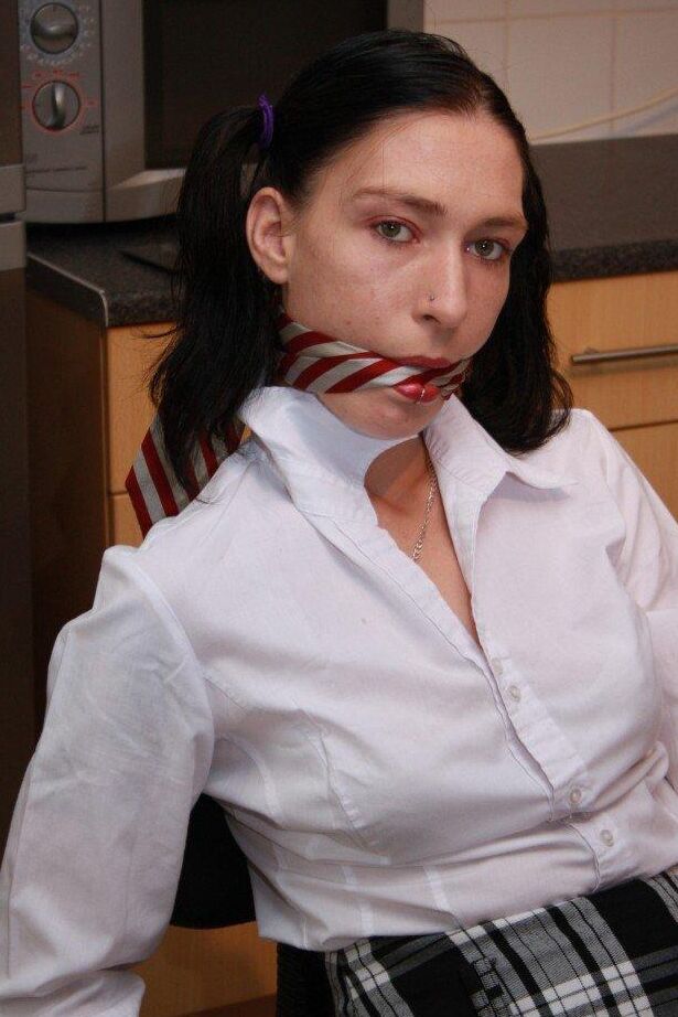 16P Brunette girl is cleave gagged and rope bound in her school uniform