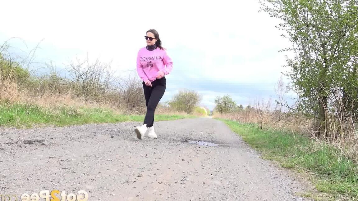 15P Barbara Bieber relieves herself on a road