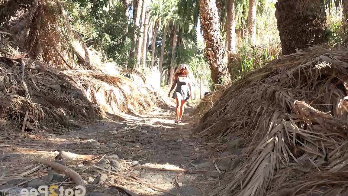 15P Chloe squats and pees on the ground on holiday