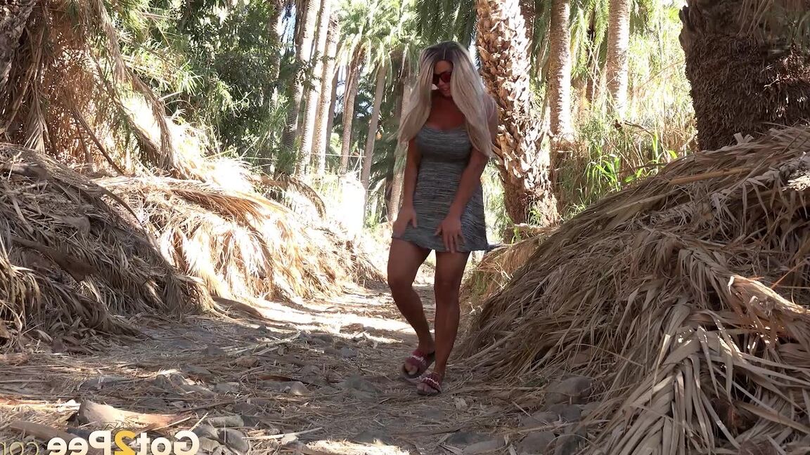 15P Chloe squats and pees on the ground on holiday