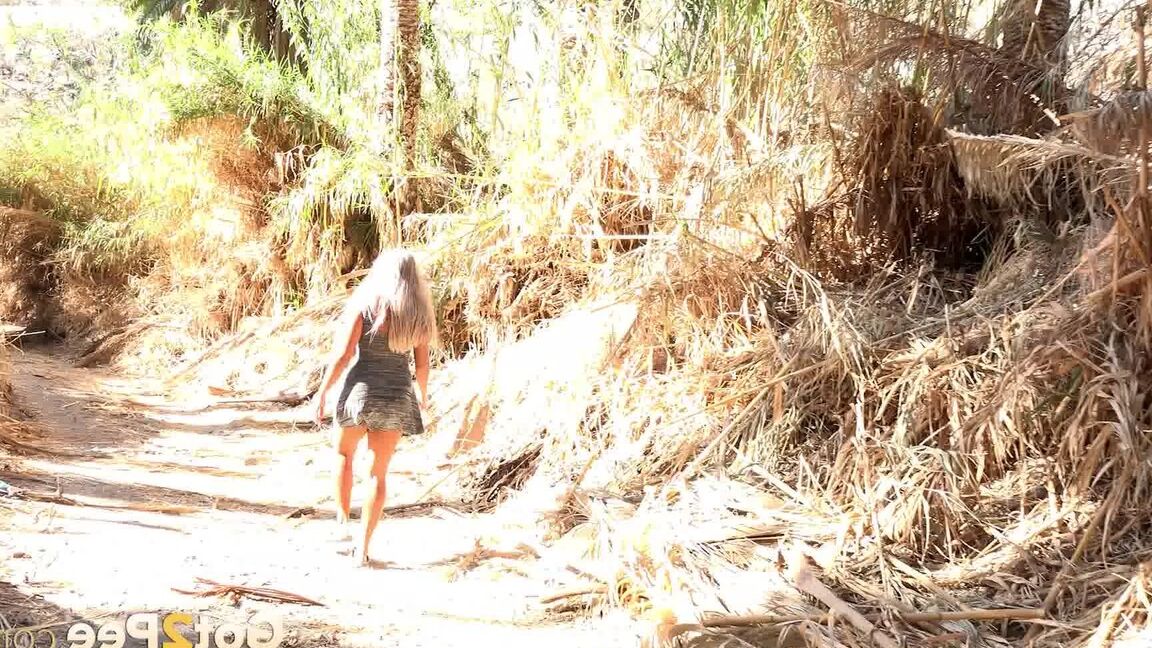 15P Chloe squats and pees on the ground on holiday