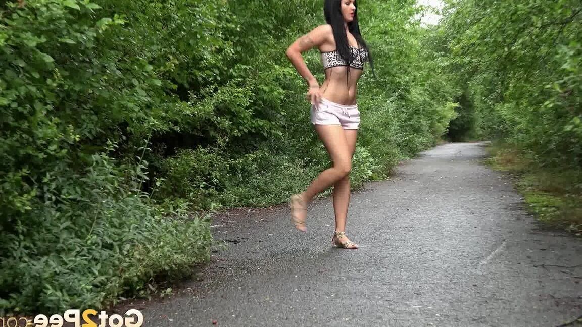 15P Tattooed hottie Miriam has to squat for a pee while walking on a trail