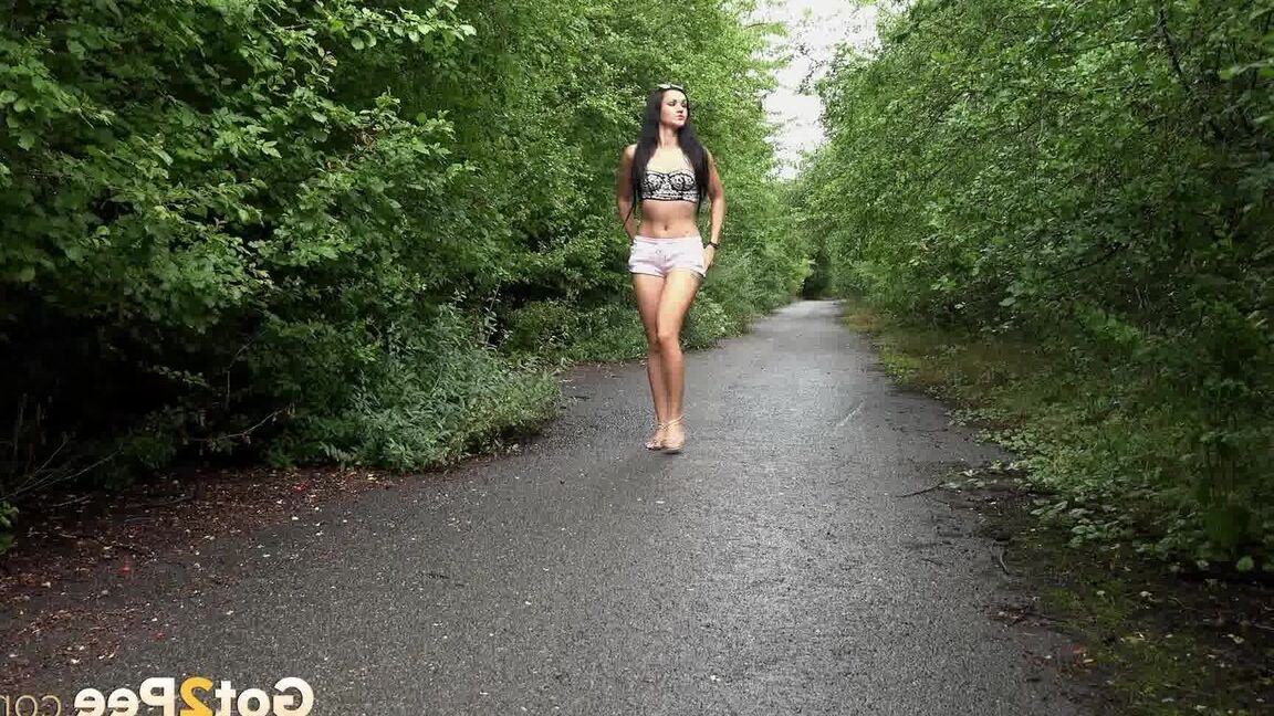 15P Tattooed hottie Miriam has to squat for a pee while walking on a trail
