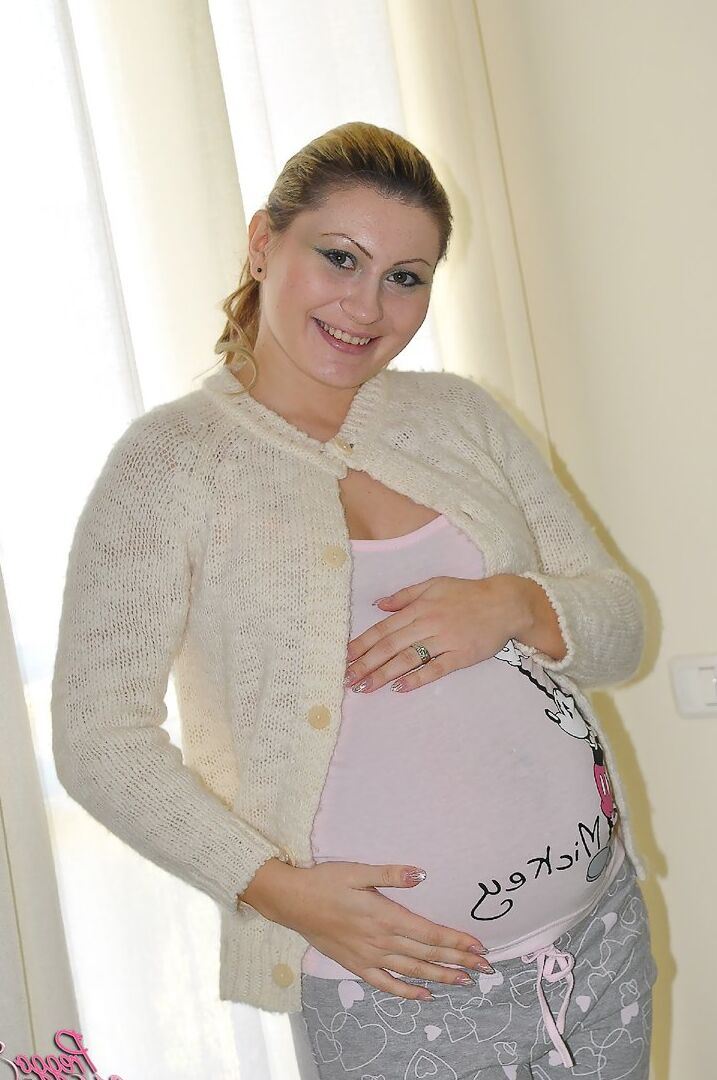 16P The cardigan is cute and the striptease takes us to full nudity with Preggo