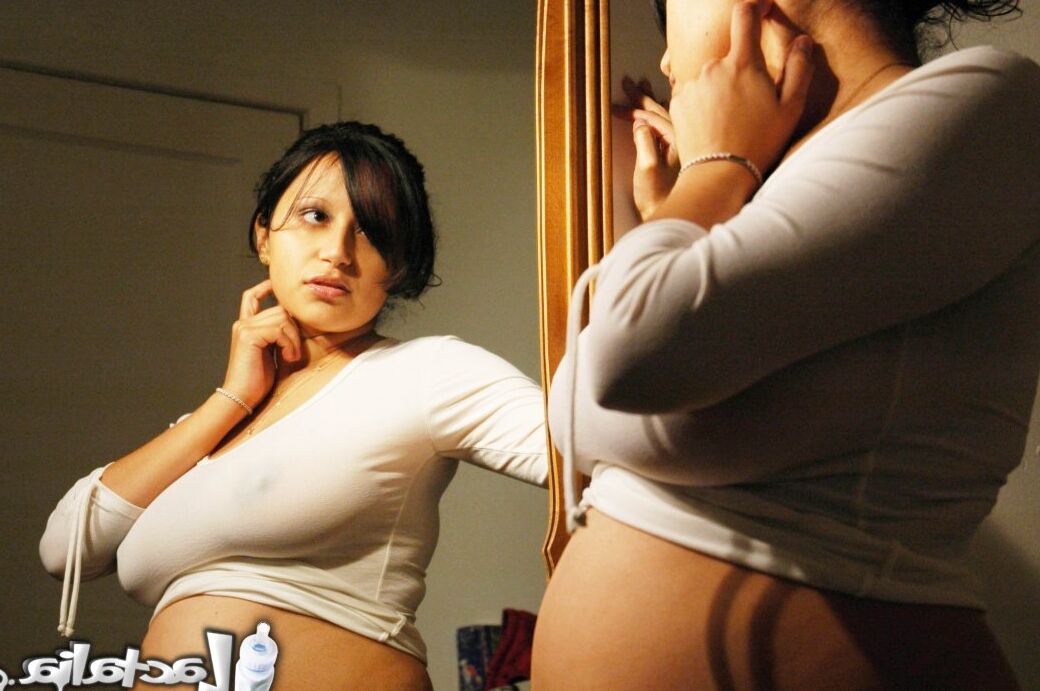 16P Talia 8 months pregnant posing in the mirror