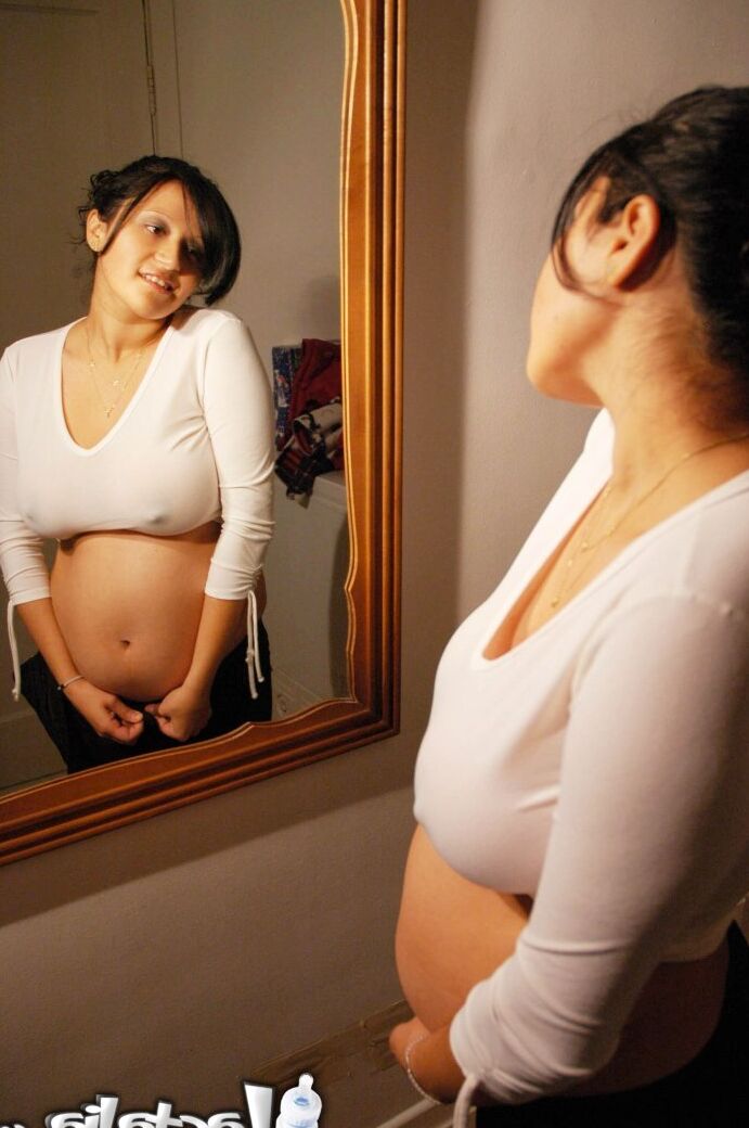 16P Talia 8 months pregnant posing in the mirror