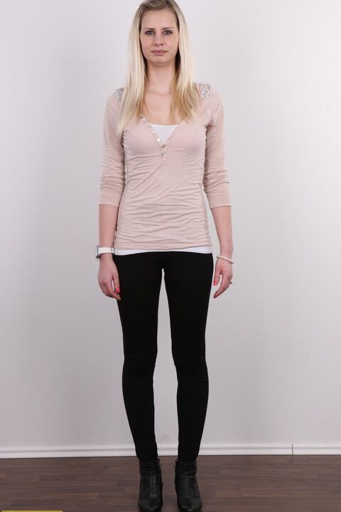 20P Tall blonde Tina stands fully clothed and then totally naked as well