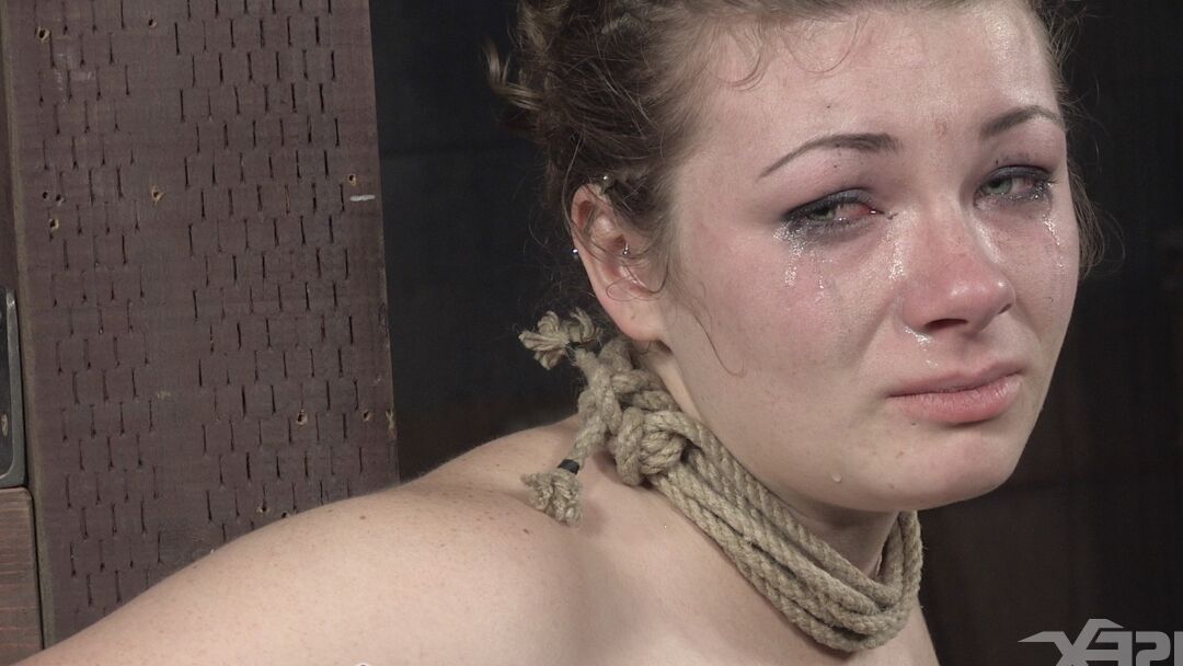 15P Restrained white girl Harley Ace is subjected to painful abuse in a dungeon