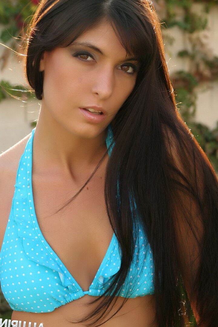 12P Brunette chick Courtney displays a pierced bellybutton while modeling a bikini