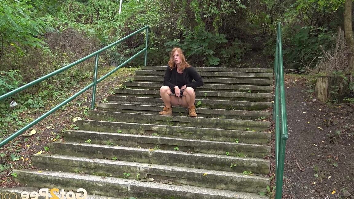 15P Natural redhead Chrissy Fox squats for a pee on a set of public steps