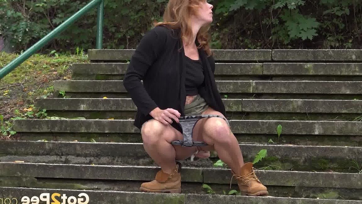 15P Natural redhead Chrissy Fox squats for a pee on a set of public steps