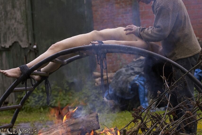 16P Helpless brunette is roasted over a fire and submerged under water