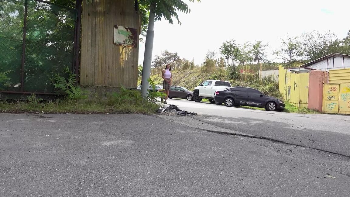 15P Distressed girl Isabel Dark takes a badly needed pee on a paved roadway