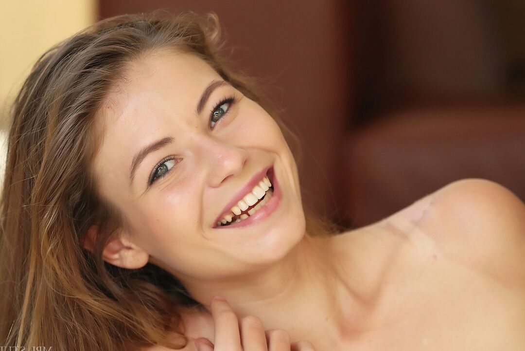 12P Sweet teen touts her tight ass and slit while modelling with no clothes on