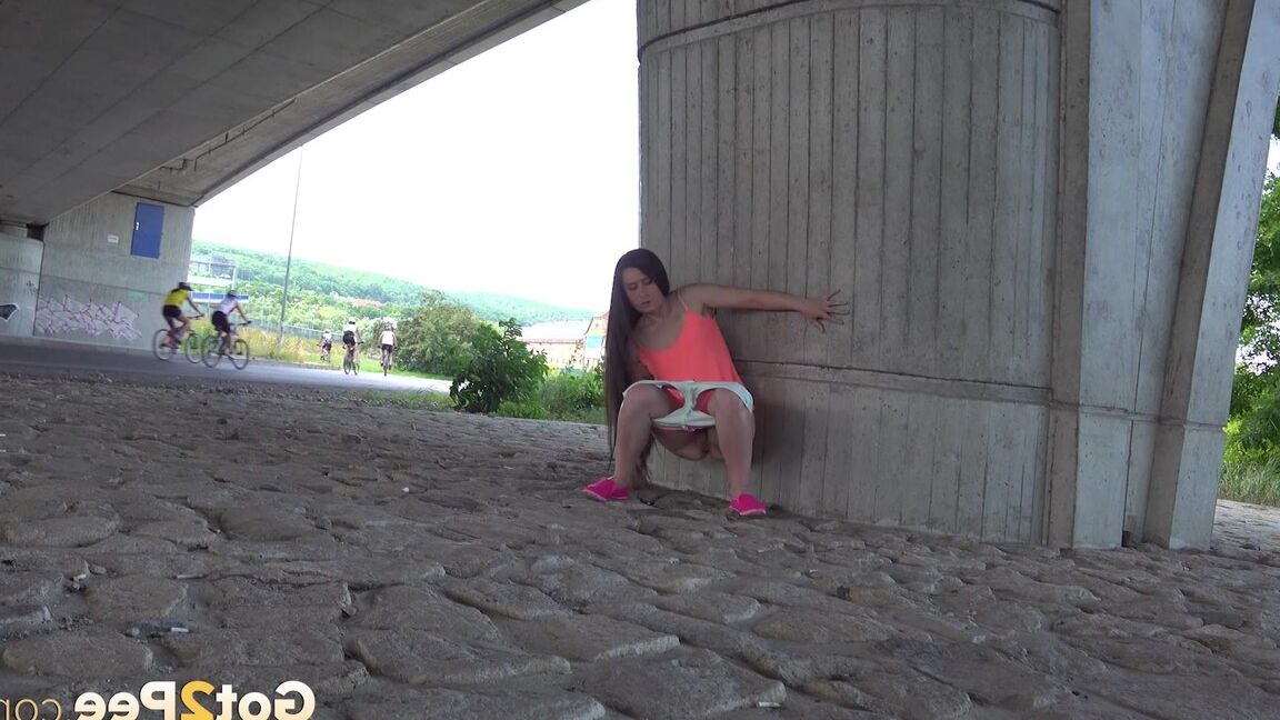 15P Lara Fox pisses in public under a bridge
