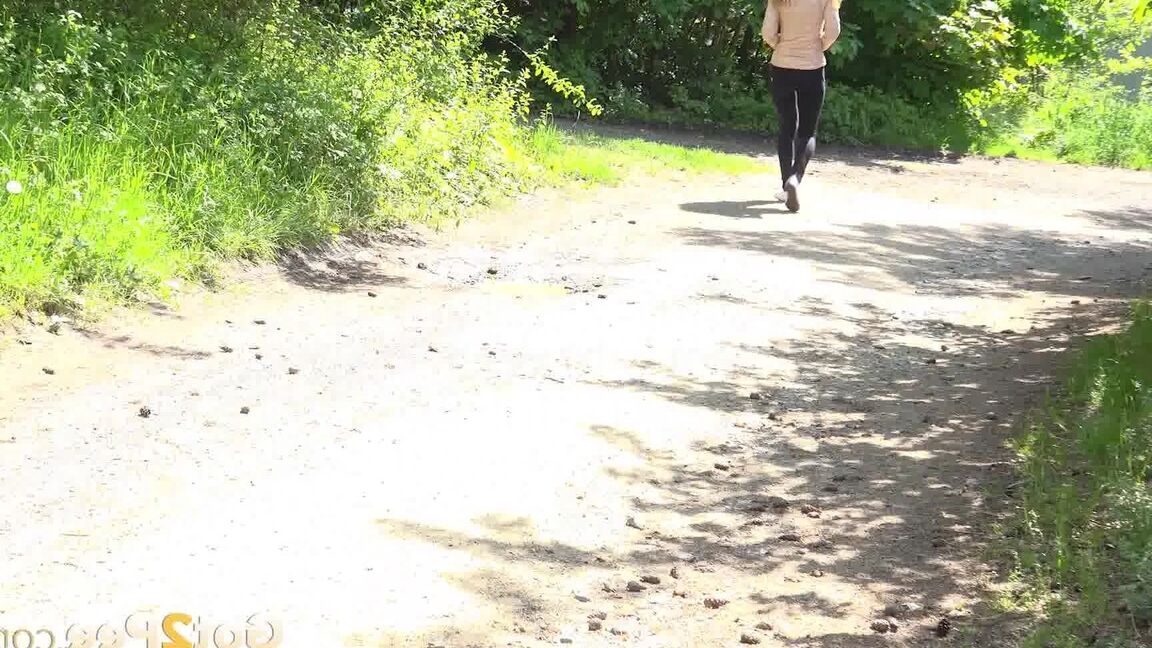 15P Euro girl Cynthia Vellons pulls down her pants to take a piss on a gravel path