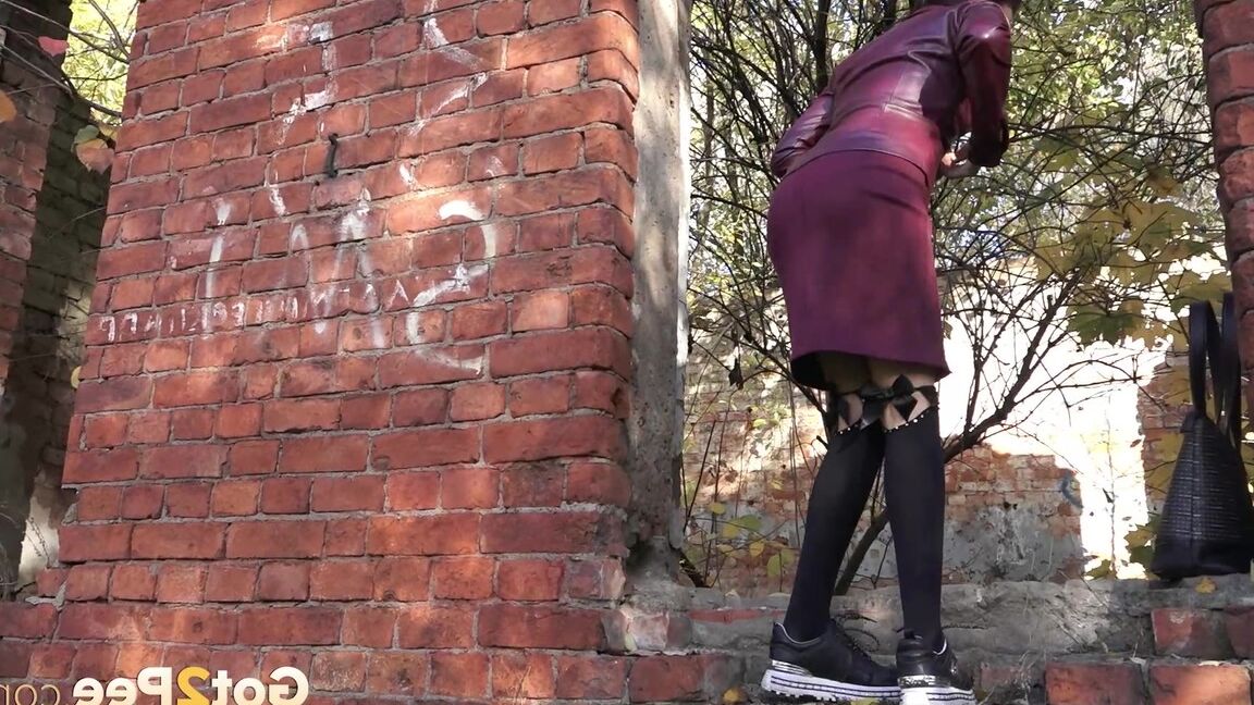 15P Stunning brunette squats in knee socks to piss