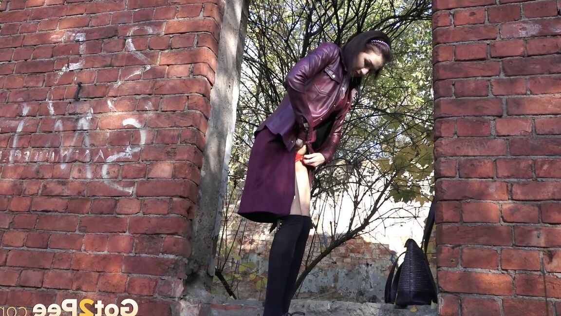 15P Stunning brunette squats in knee socks to piss