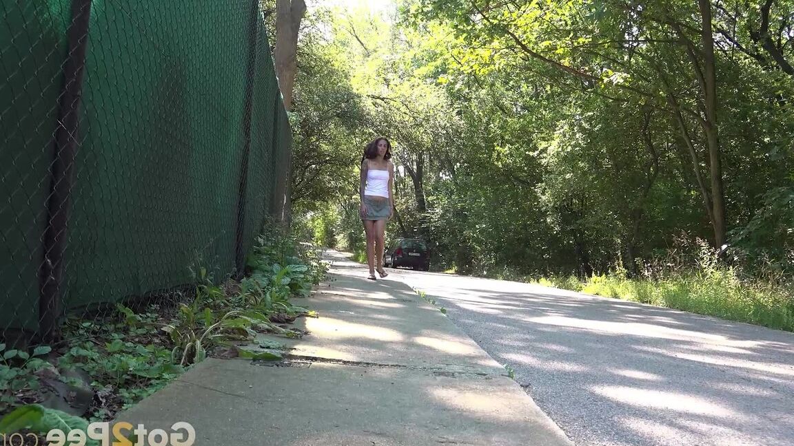 15P Ali B squats on a path and pees outside